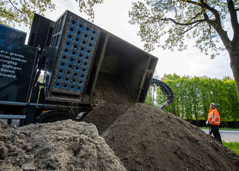 Afvoeren tuingrond en zand